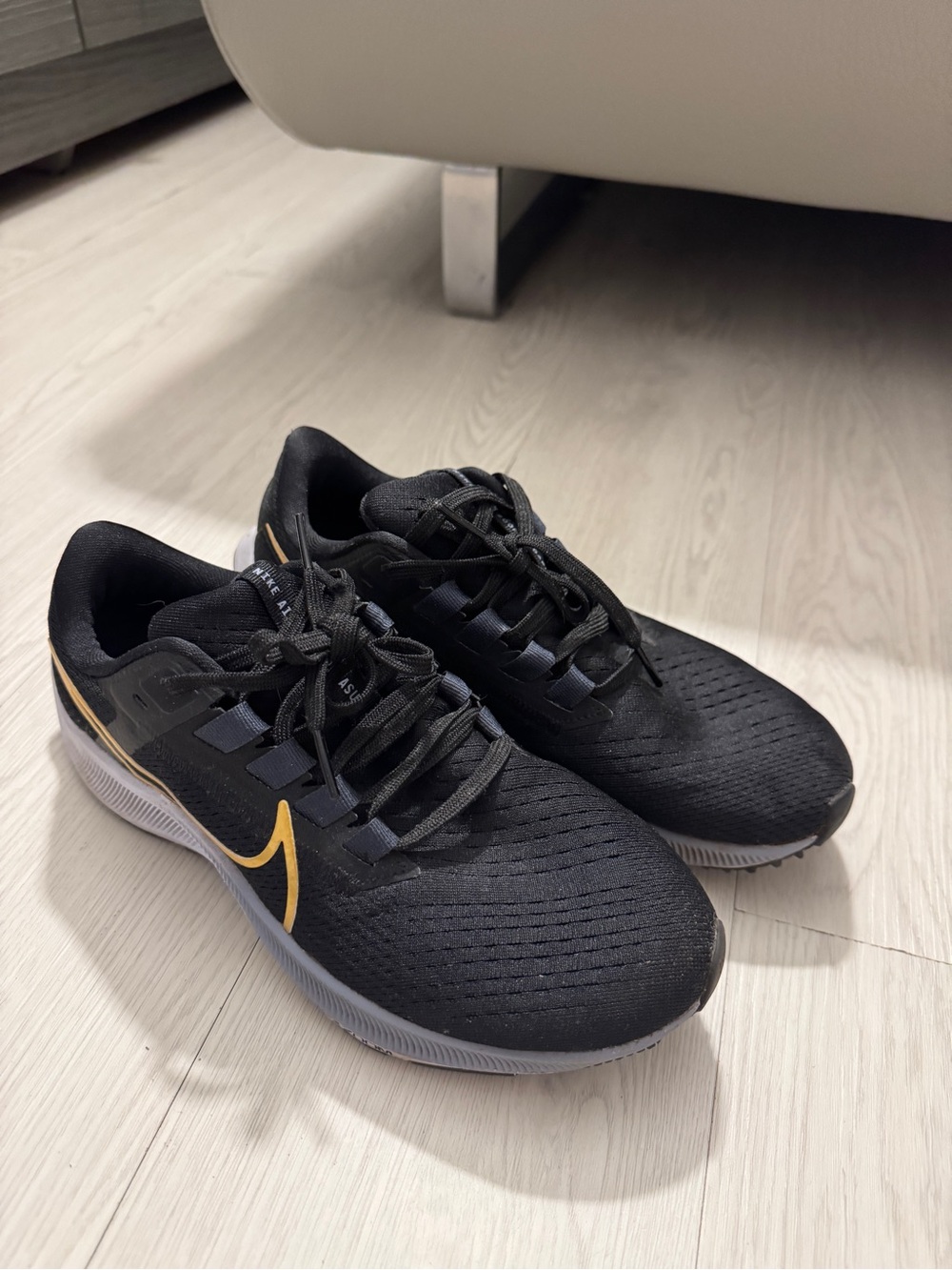 Women’s Nike Air Zoom Pegasus 38 Black Sneaker with Gold Swoosh